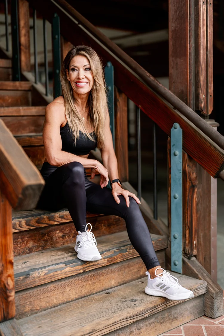 An athlete seated on wooden steps after a session